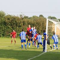 Barnes, surrounded by Wroxham players fails to dir